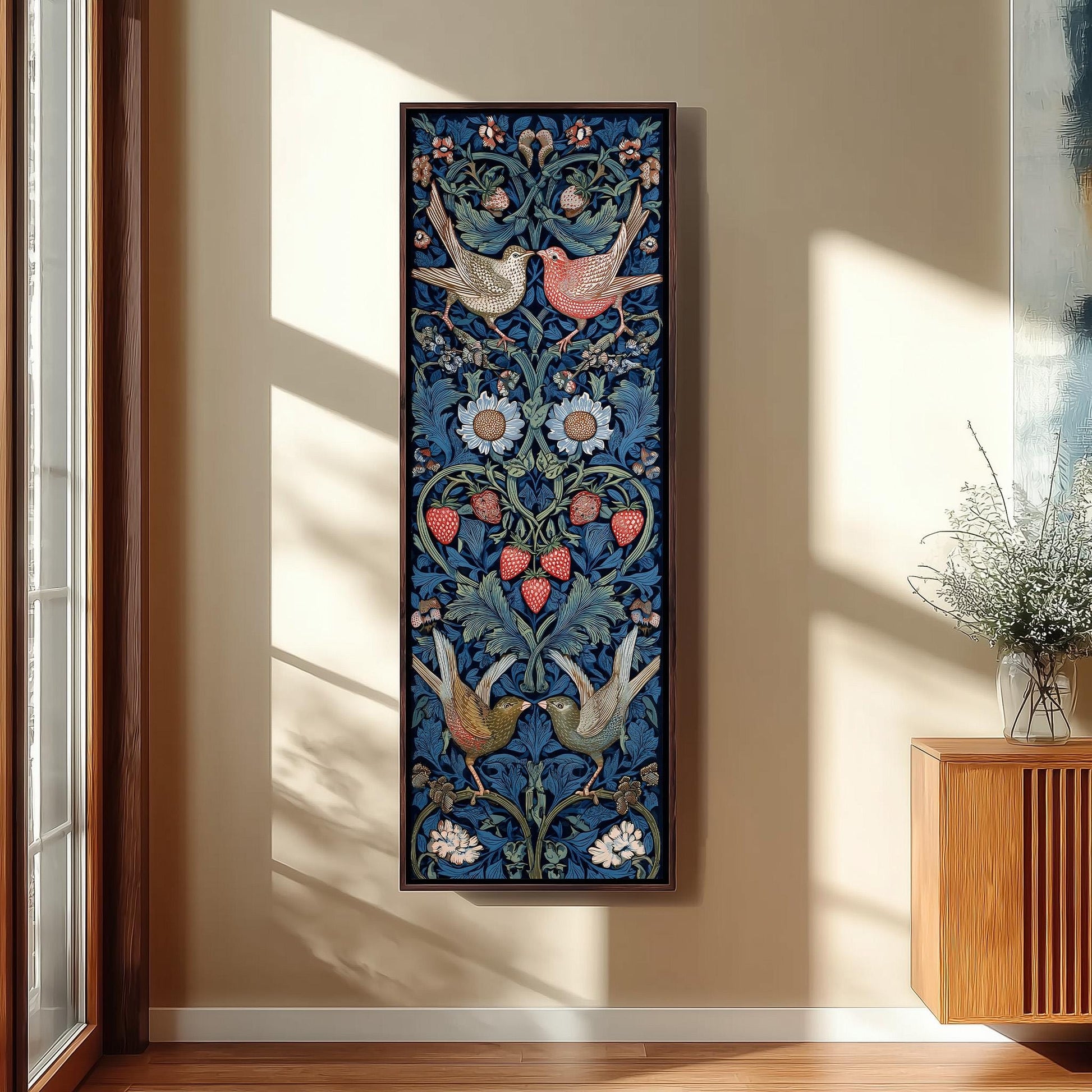 a large, colorful tapestry hanging on a wall, depicting a floral design with birds and strawberries.