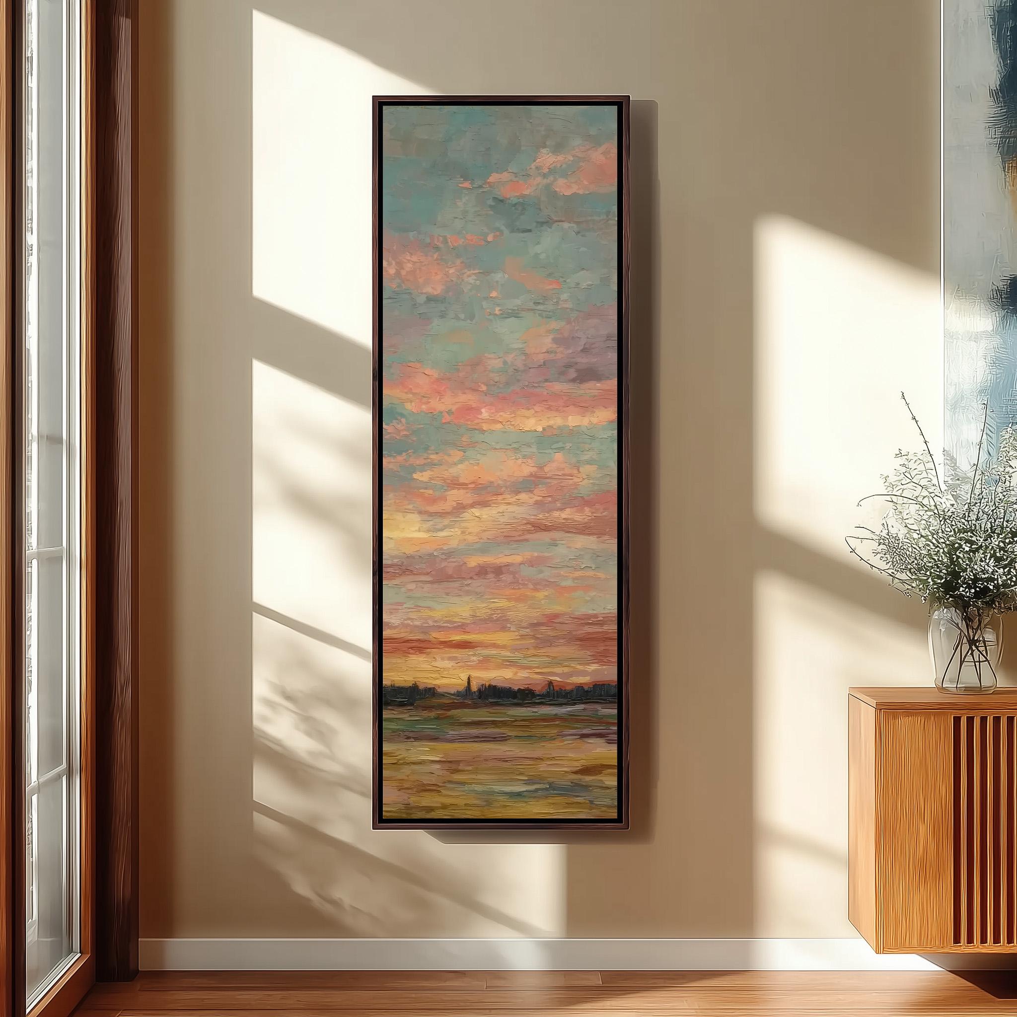 a large, colorful painting of a sunset landscape hanging on a wall in a room with a wooden floor and a window.