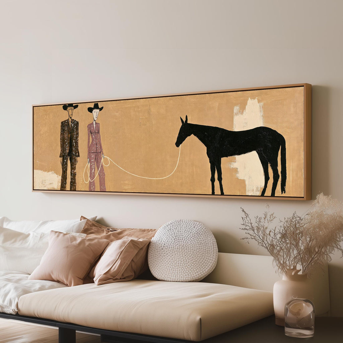 Stylized cowboy and cowgirl with a horse long horizontal canvas print above a sofa in a living room