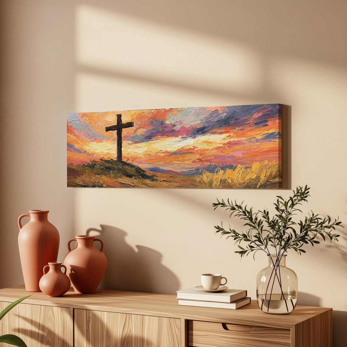 Cross on a hill at sunset long horizontal canvas print above a wooden sideboard
