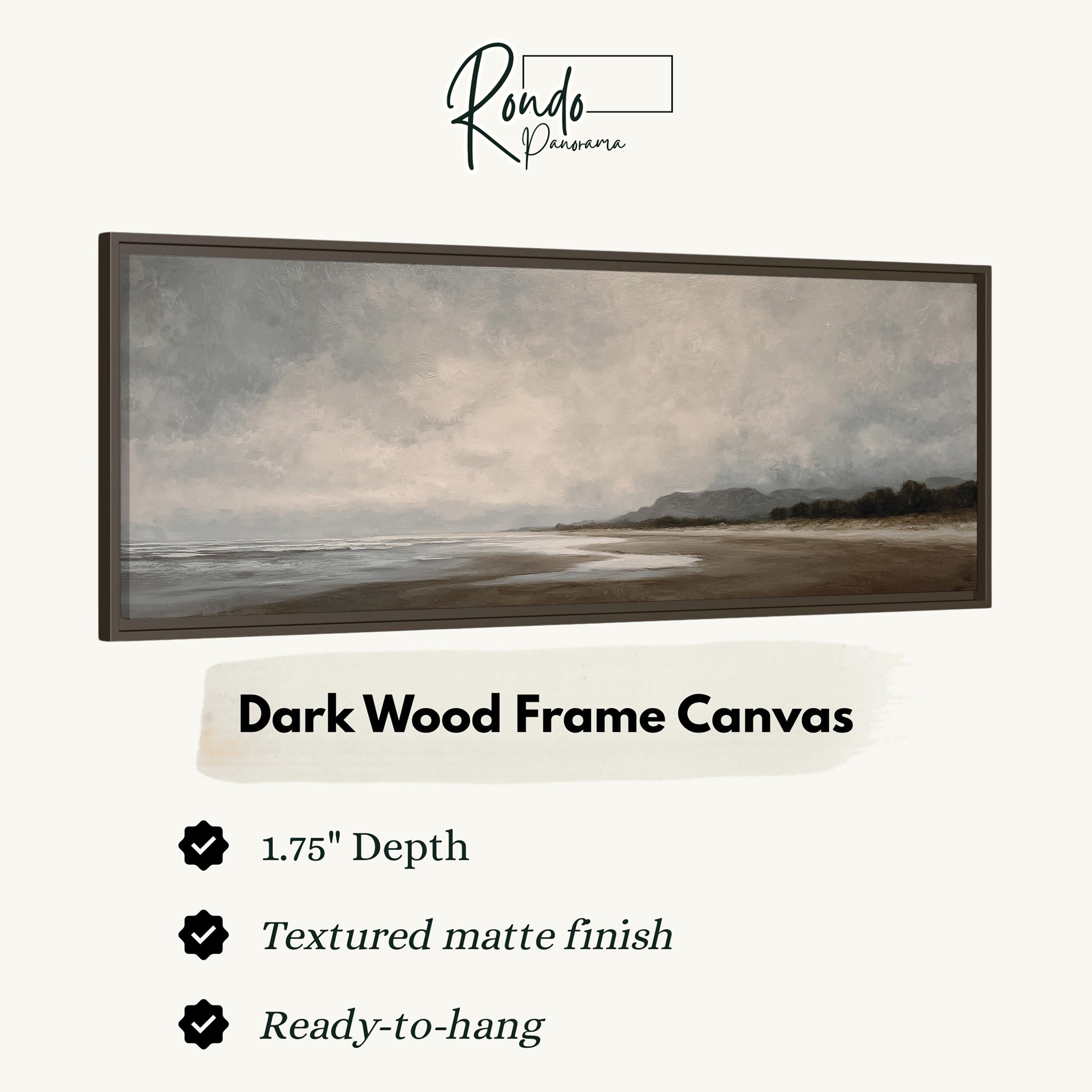 The image is a dark wood frame canvas depicting a serene landscape with a beach and mountains in the background.