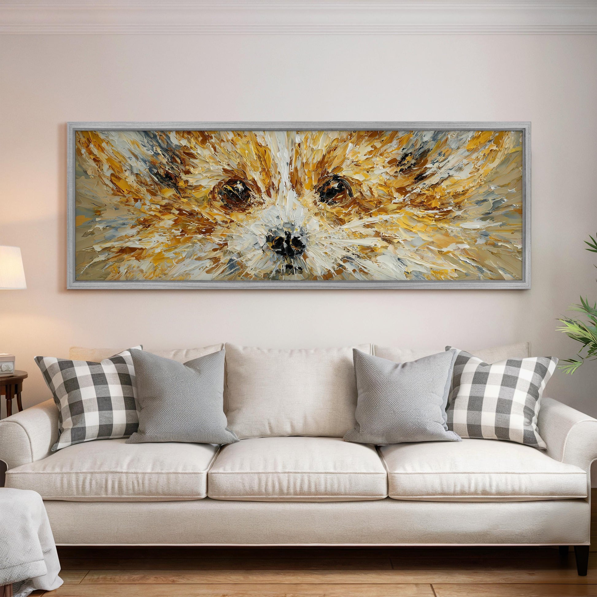 a large, colorful painting of a dog's face hanging on a wall above a white couch with gray and white plaid throw pillows.