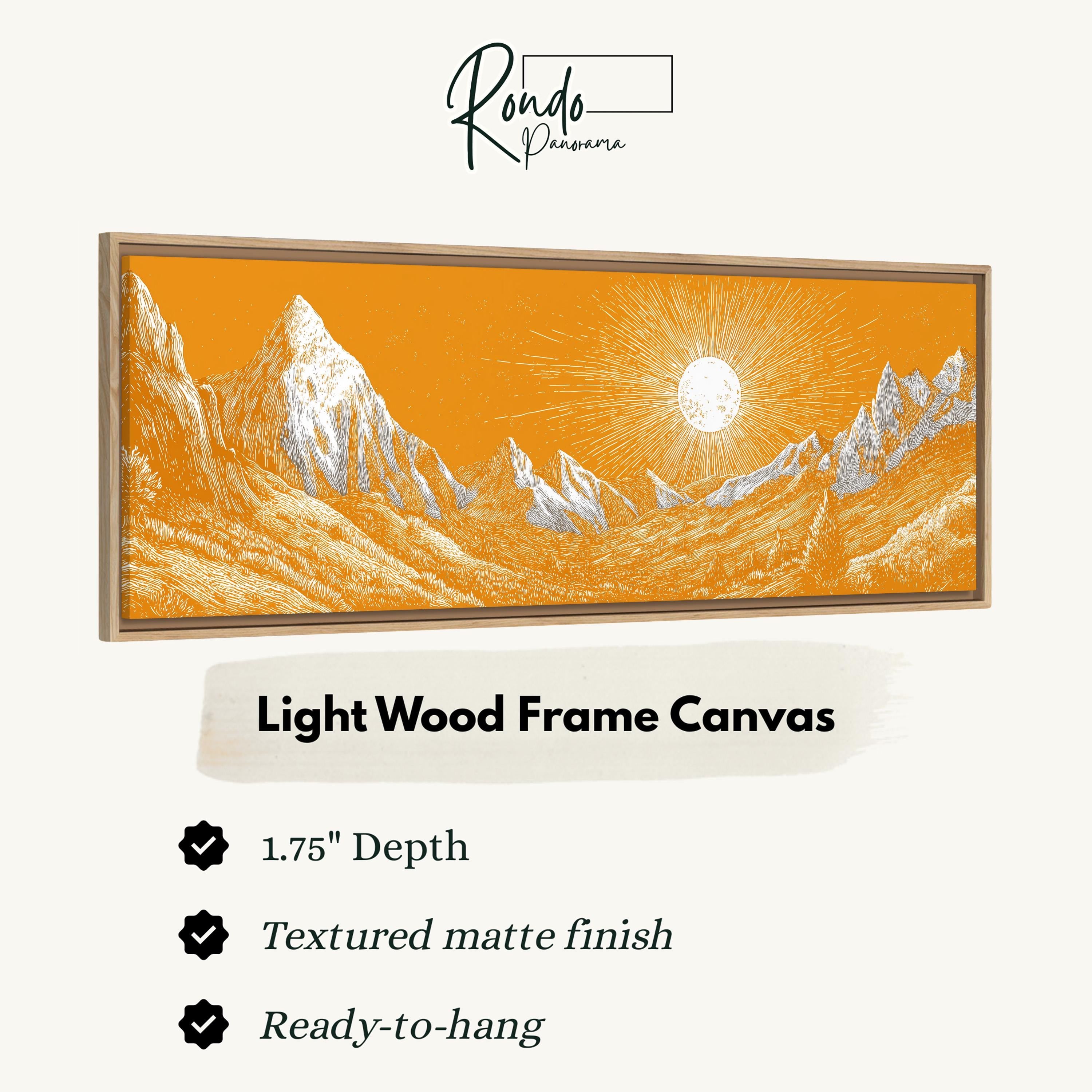 a light wood frame canvas depicting a mountain landscape with a sun shining in the background.