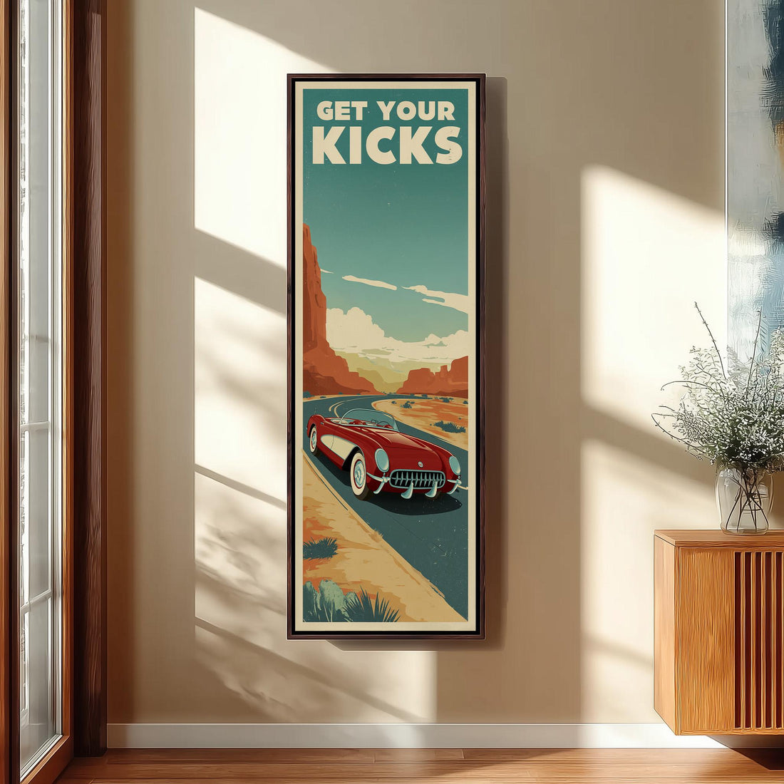 a framed poster of a red sports car on a road, with the text "GET YOUR KICKS" displayed prominently.