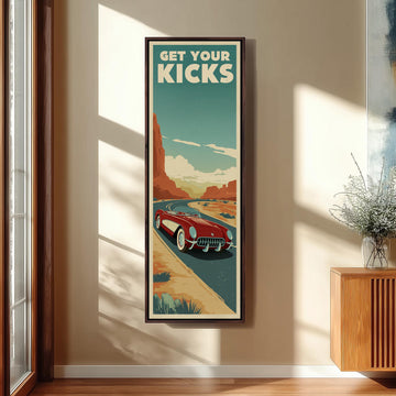 a framed poster of a red sports car on a road, with the text "GET YOUR KICKS" displayed prominently.