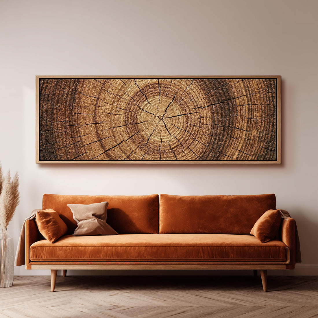 Warm oak wood ring long horizontal canvas print above a sofa in a living room