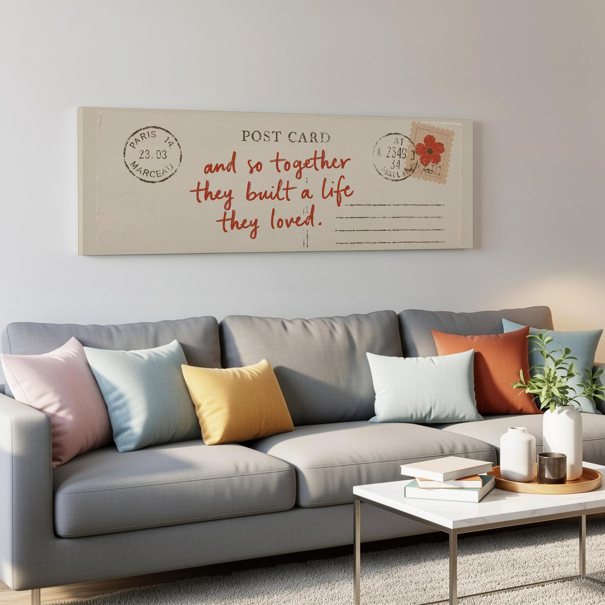 Paris postcard saying and so together they built a life they loved panoramic canvas print above a grey sofa in a living room