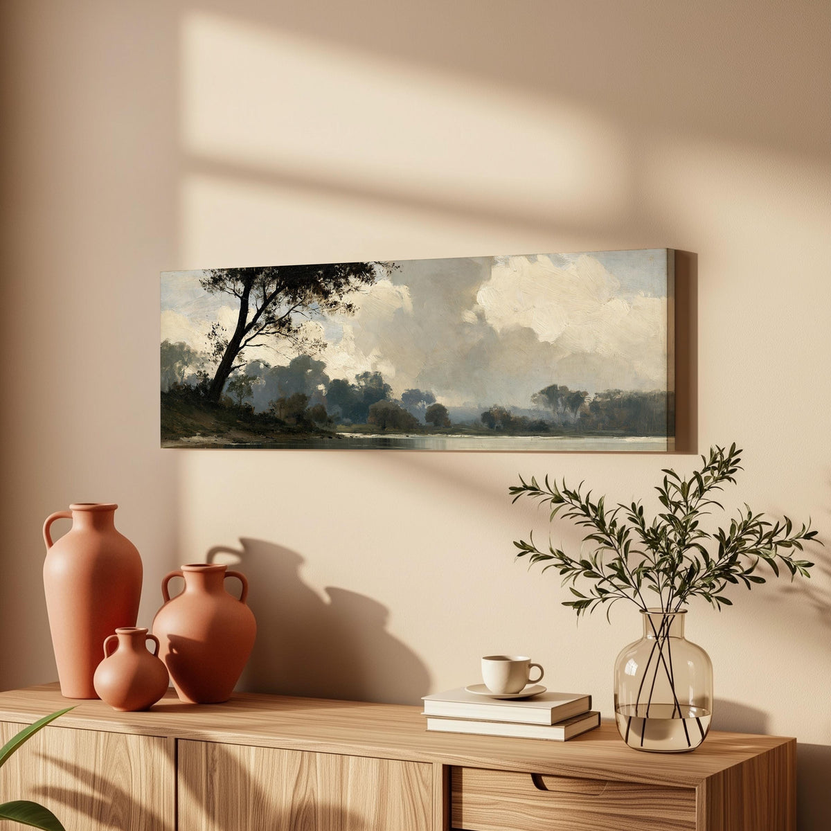 Misty river landscape in grey blue tones long horizontal canvas print above a wooden sideboard