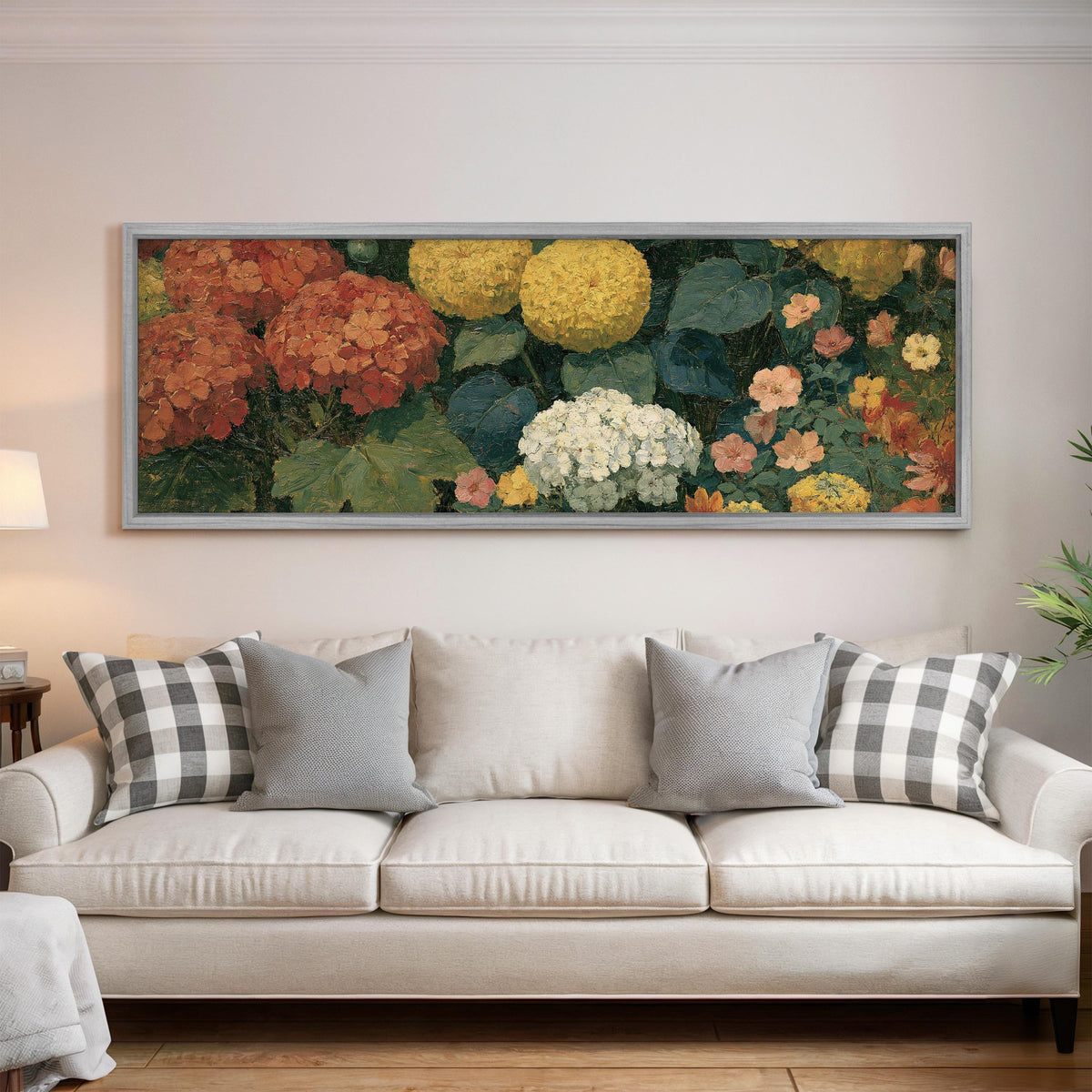 Warm hydrangea and dahlia bouquet panoramic canvas print above a white sofa in a bright living room