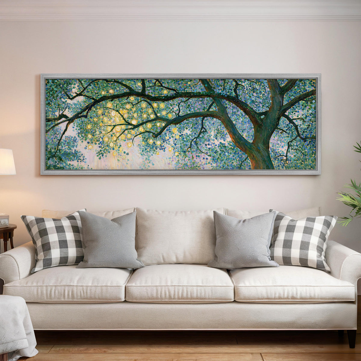 Tree canopy with golden light panoramic canvas print above a white sofa in a bright living room