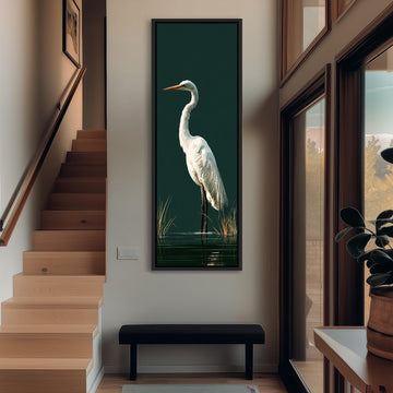 Great egret standing on dark green long vertical canvas print in a sunlit living space