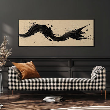 a modern living room with a black and white checkered sofa, a stack of books, and a large abstract painting on the wall.
