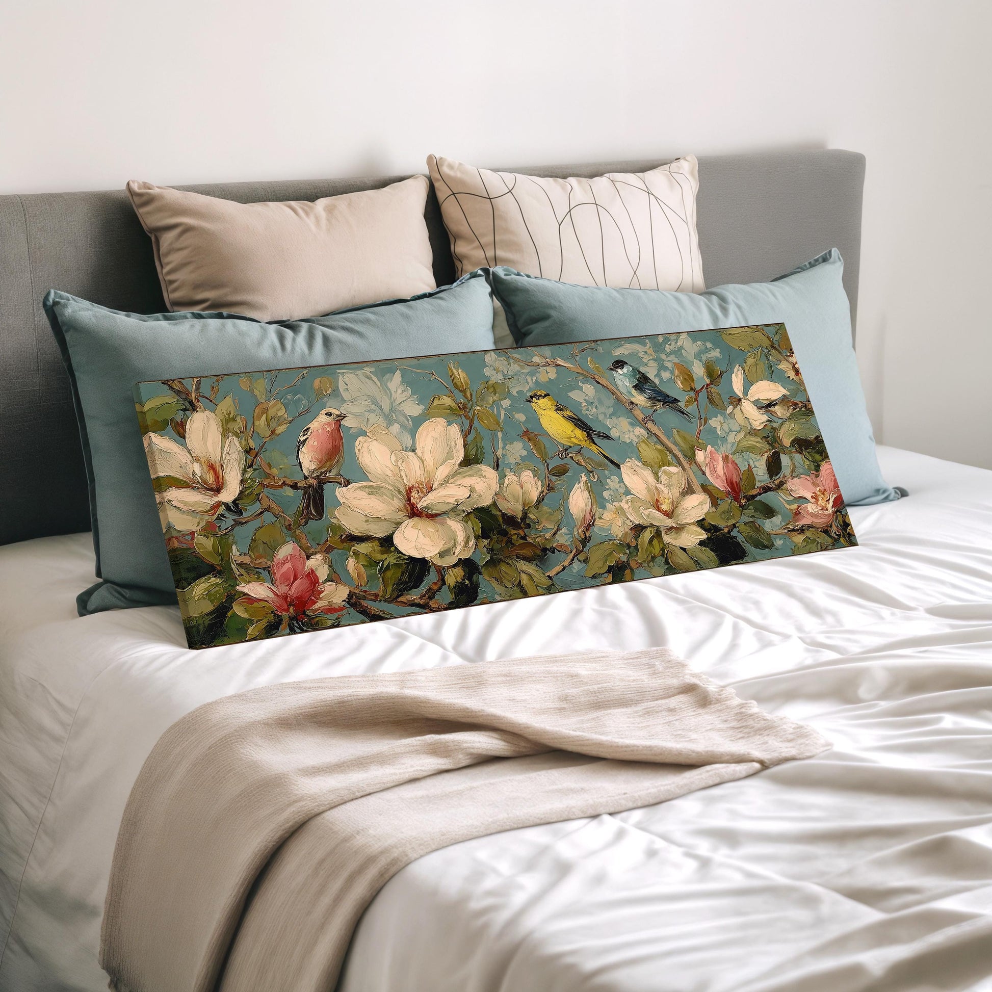 a bedroom with a bed and a large floral print on the bed. The print features a variety of flowers and birds, creating a vibrant and nature-inspired design.