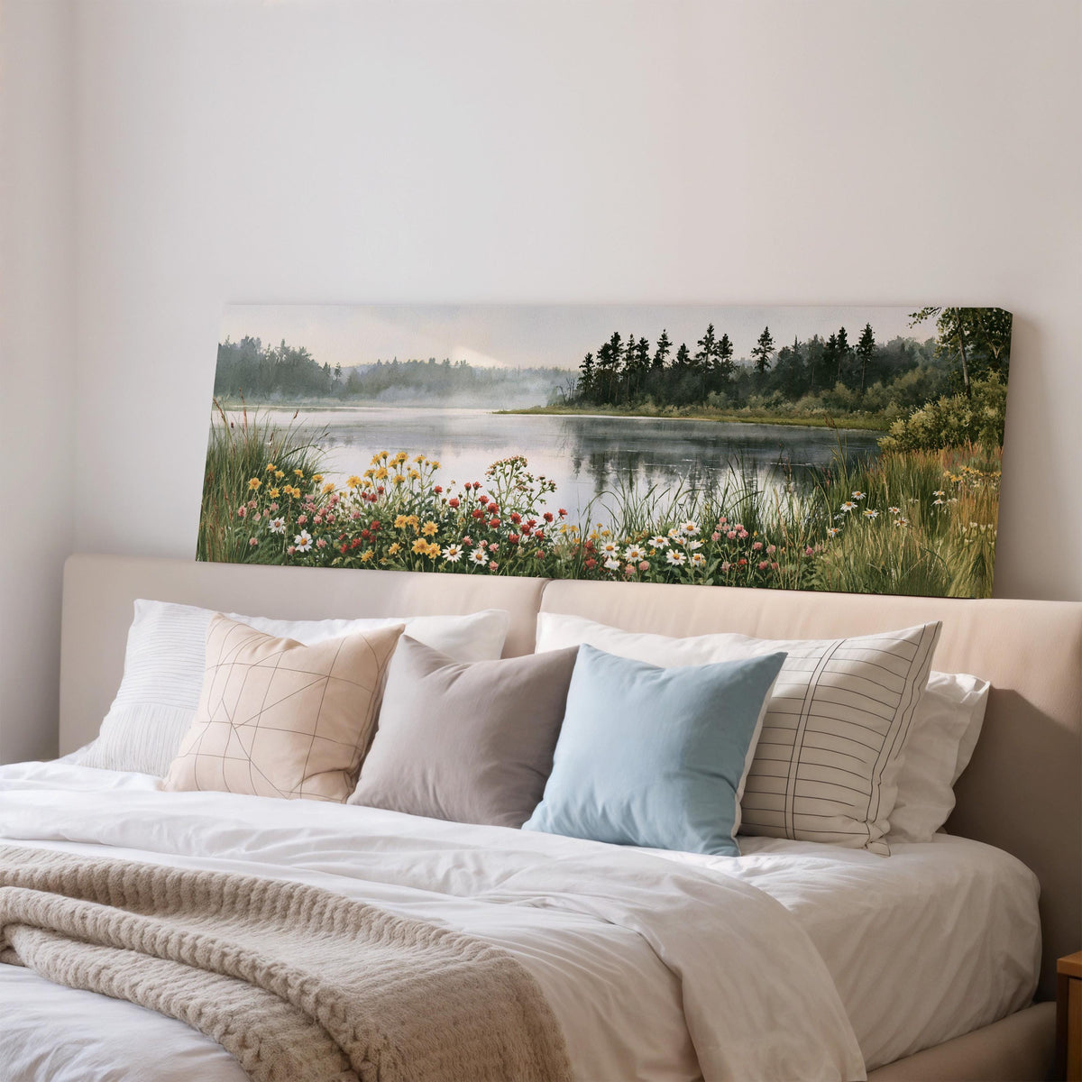 Lake with wildflowers on the shore wide panoramic canvas print above a bed in a bedroom