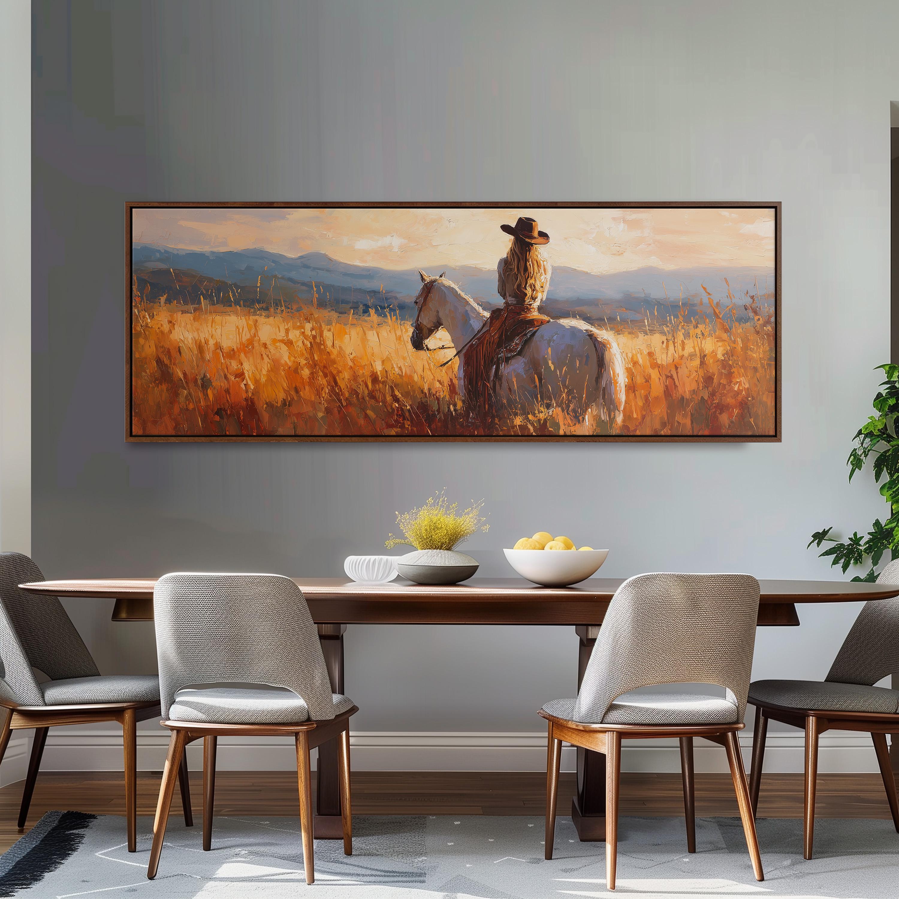 a large painting of a cowboy riding a horse in a field, with a bowl of fruit and a vase on the table in front of it.