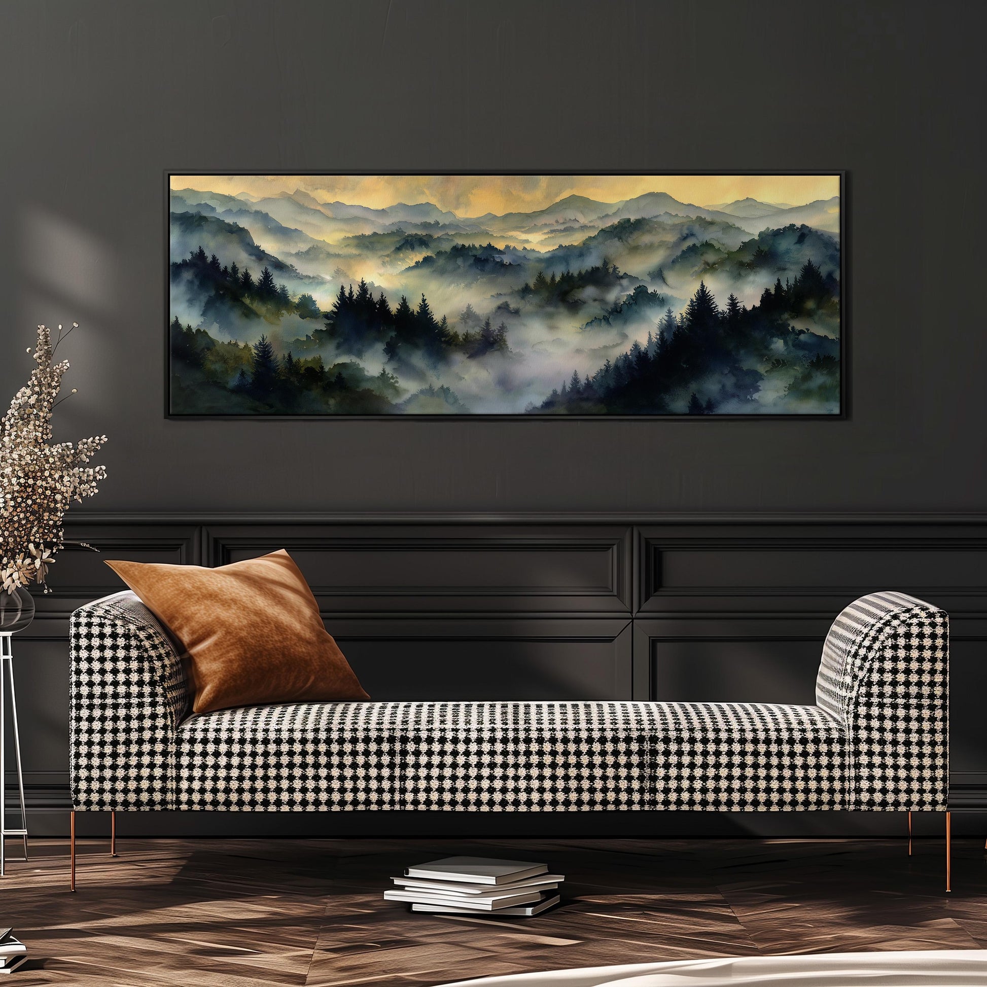 a large landscape painting hanging on a wall above a black and white checkered sofa with a brown throw pillow.
