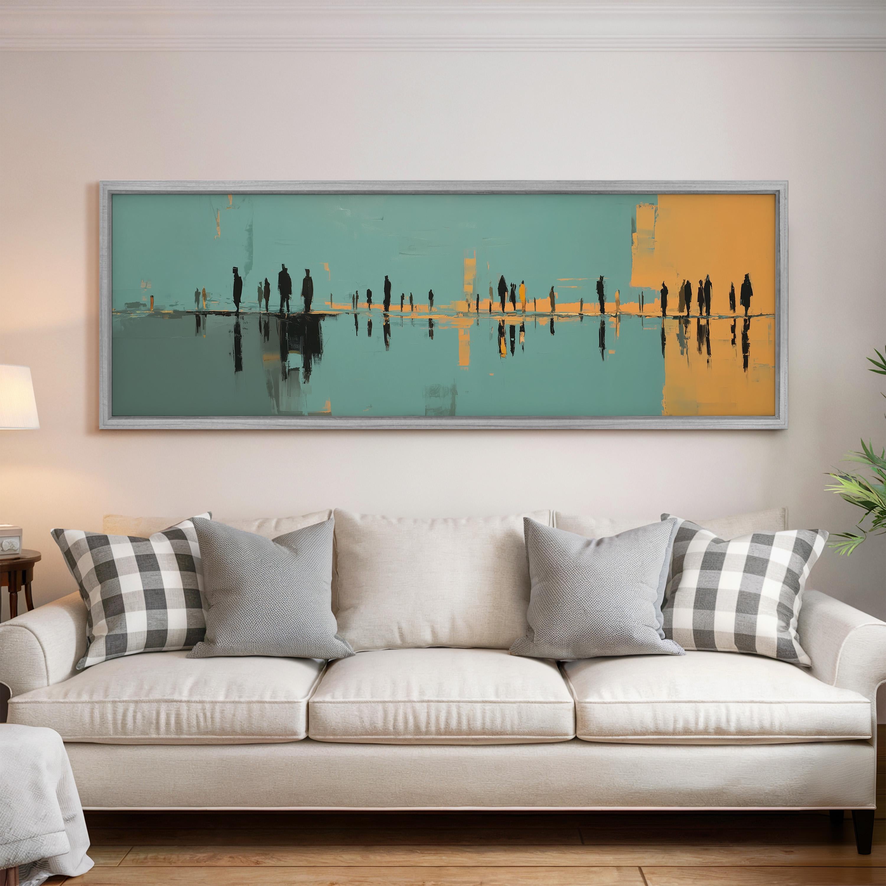 a large, colorful painting hanging on a wall above a white couch with gray and white plaid throw pillows.