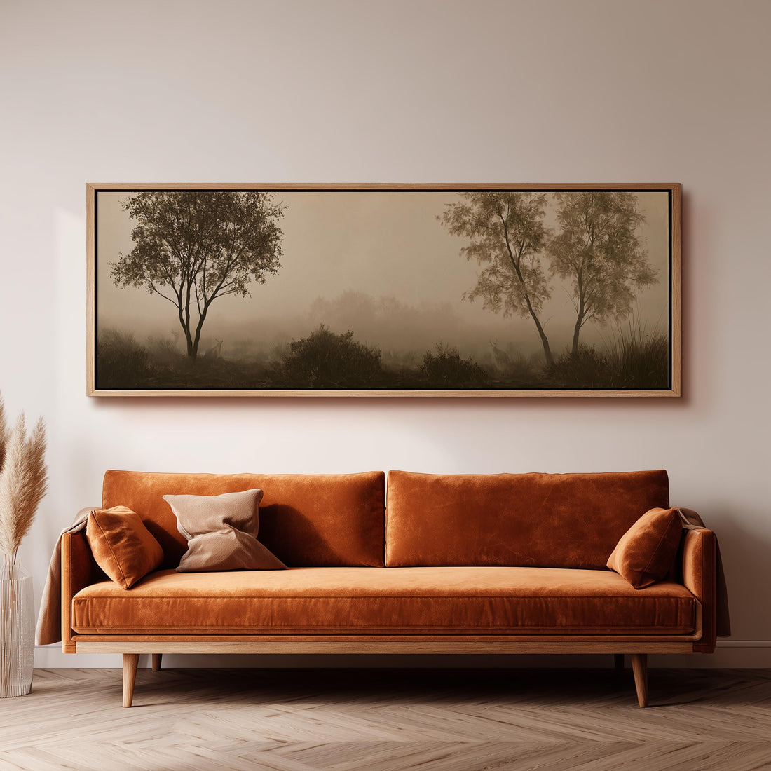 Two trees in sepia fog long horizontal canvas print above a sofa in a living room