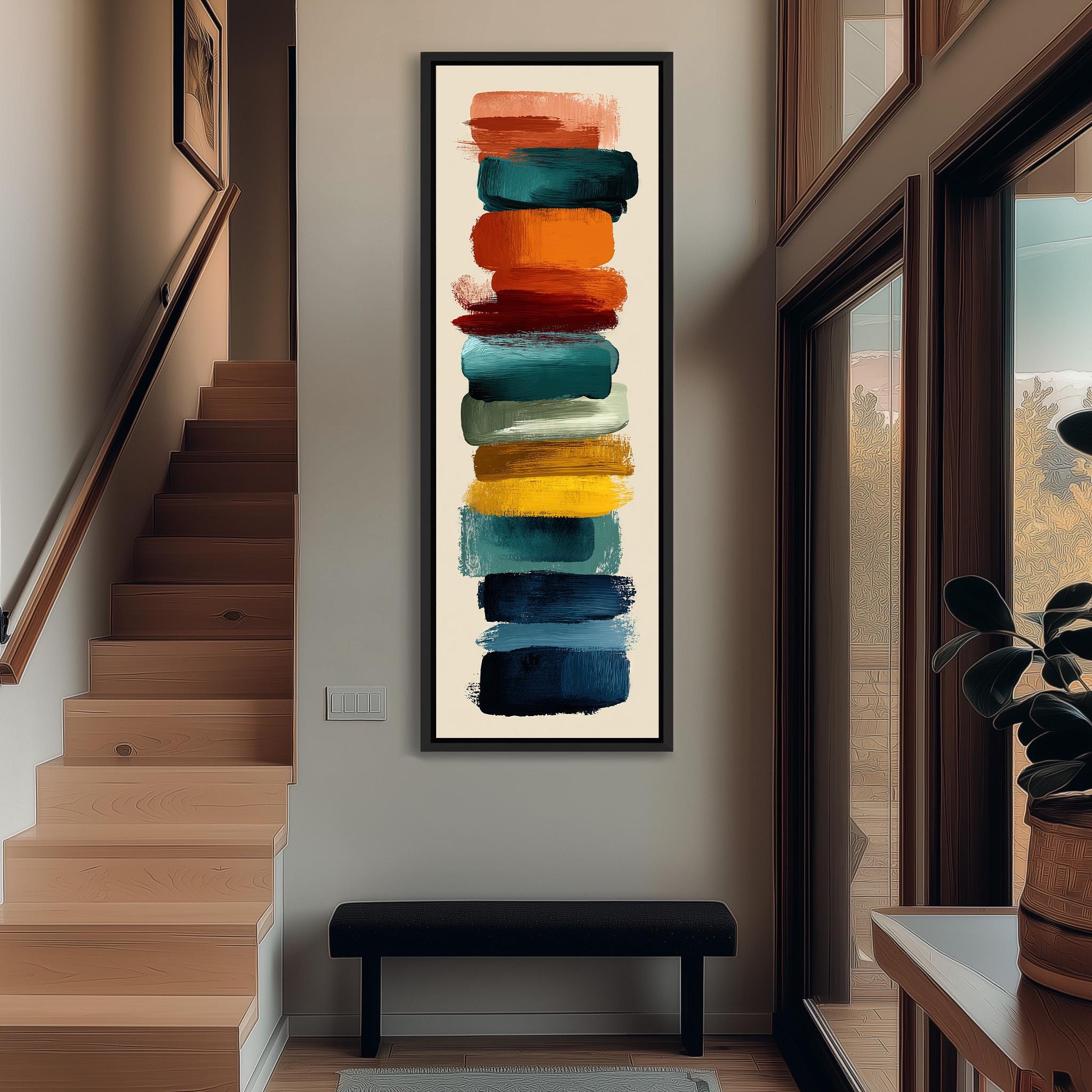 a modern art piece with a vertical arrangement of colorful brushstrokes on a white background, hanging on the wall of a hallway.