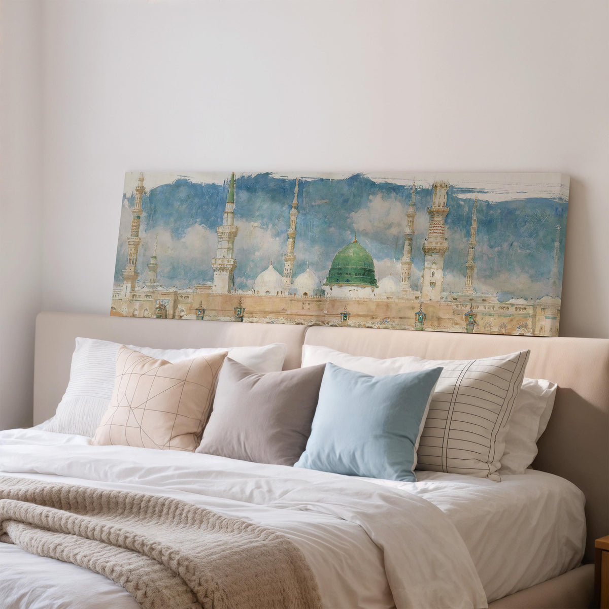 The green dome of the Prophet's Mosque in Medina wide panoramic canvas print above a bed in a bedroom
