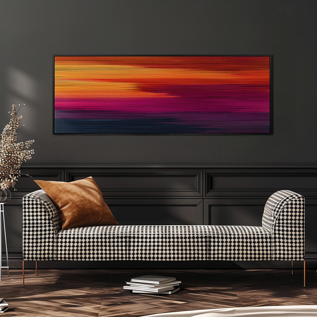 a modern living room with a black and white checkered sofa, a stack of books, and a large abstract painting on the wall.