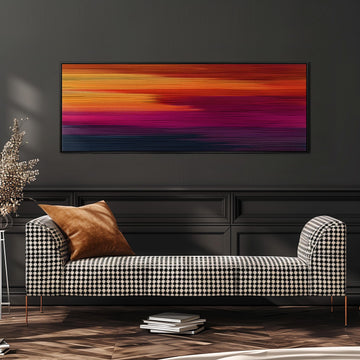 a modern living room with a black and white checkered sofa, a stack of books, and a large abstract painting on the wall.