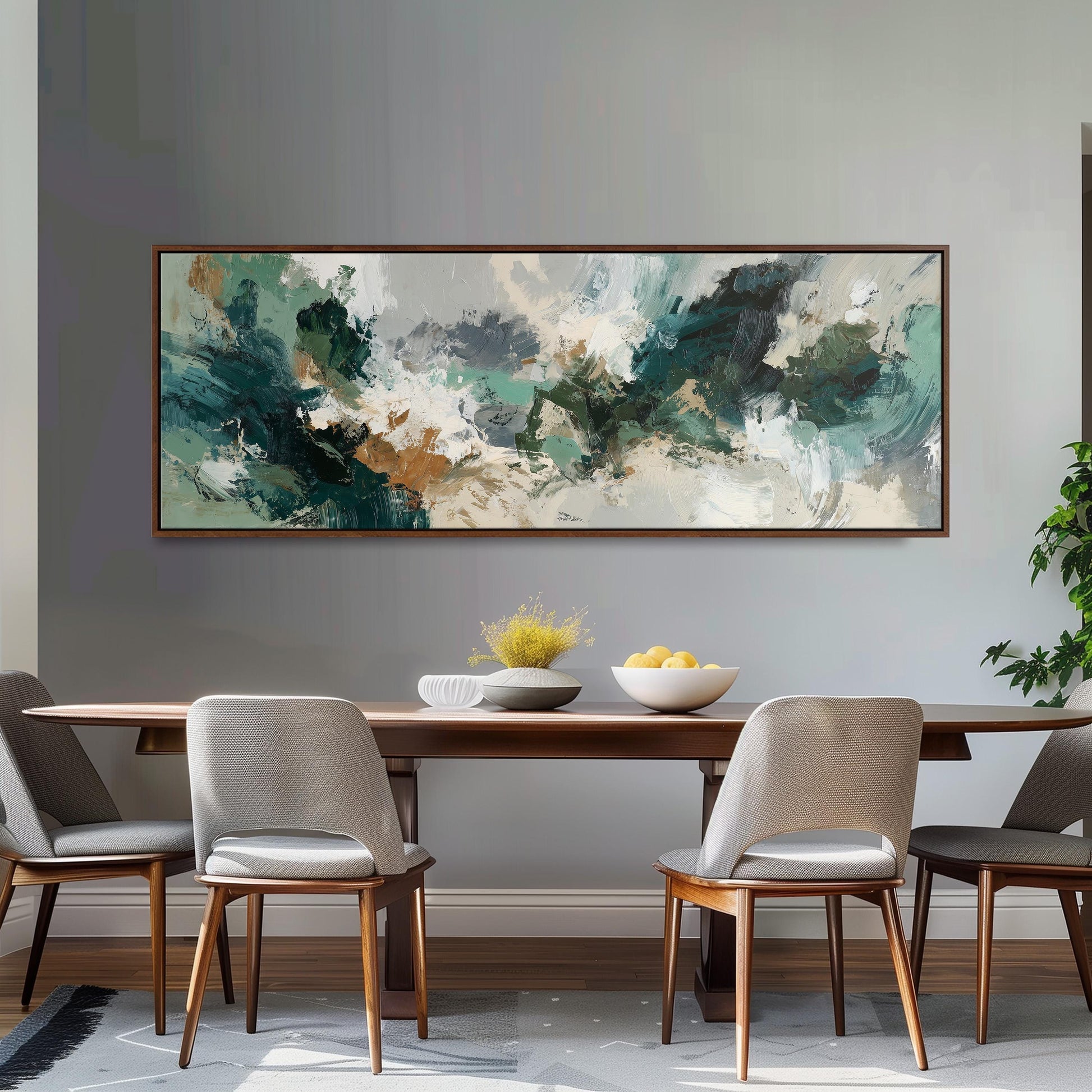 a dining room with a large abstract painting hanging on the wall above a wooden dining table with four chairs. The table is set with a bowl of fruit and a vase of flowers, creating a cozy and inviting atmosphere.