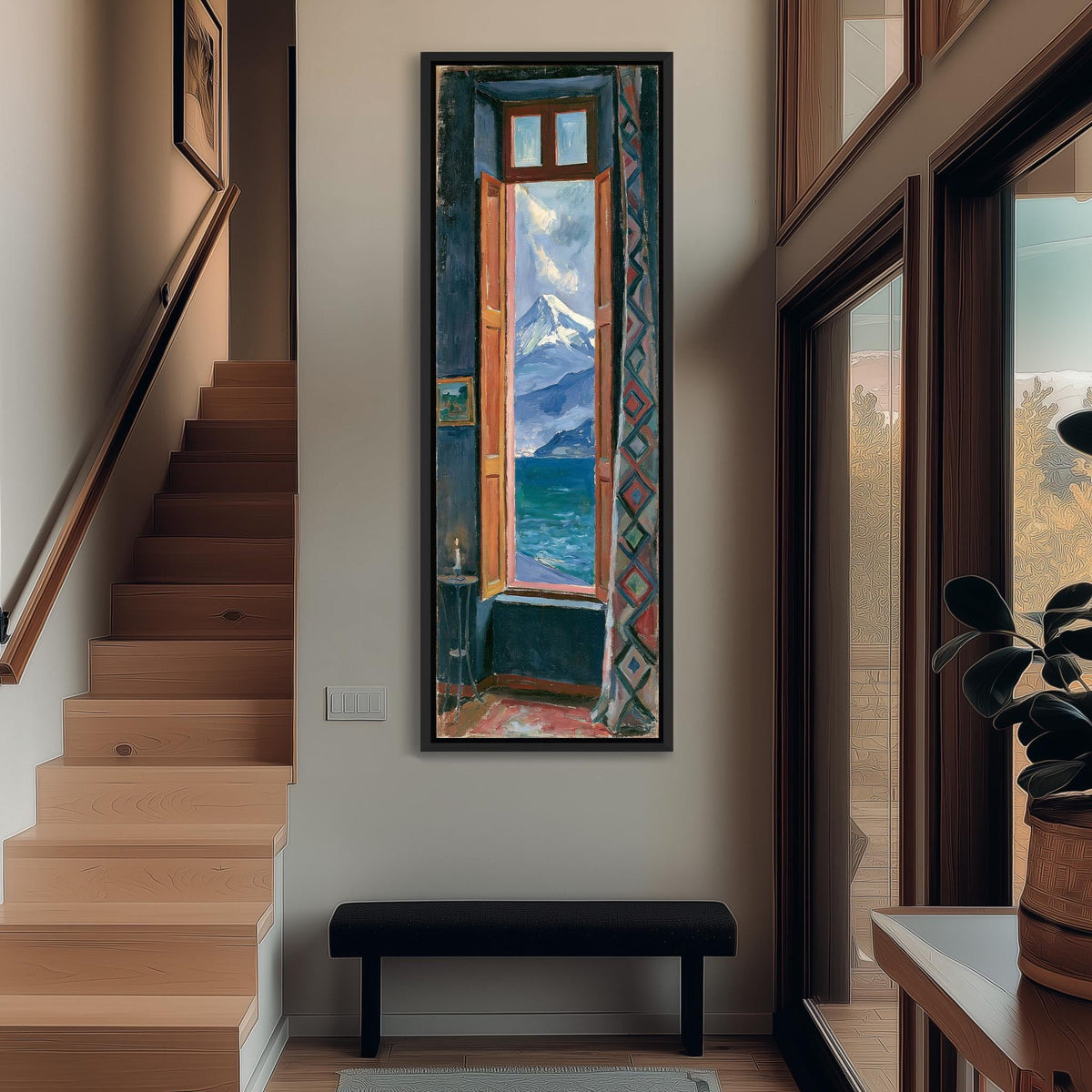Snowy mountain and sea seen through a tall window tall narrow canvas print beside a staircase in an entryway