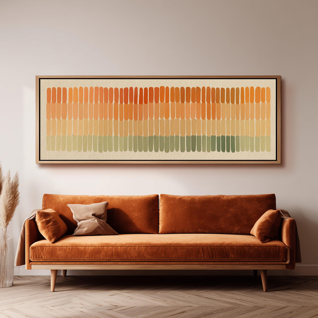 a large, rectangular, abstract painting hanging on a wall above a brown sofa with two pillows.