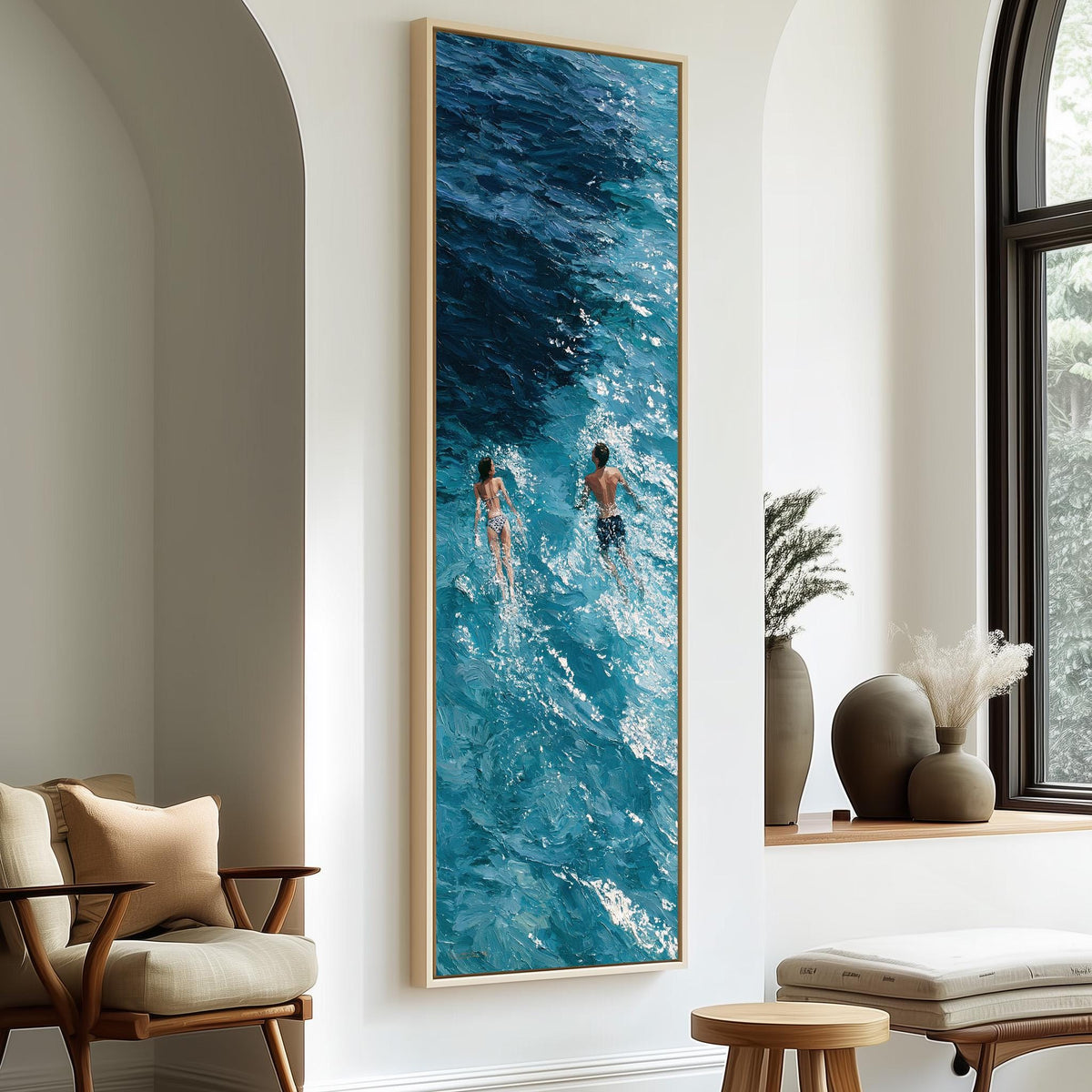 Two swimmers in deep blue waves tall skinny canvas print in a sunlit living space
