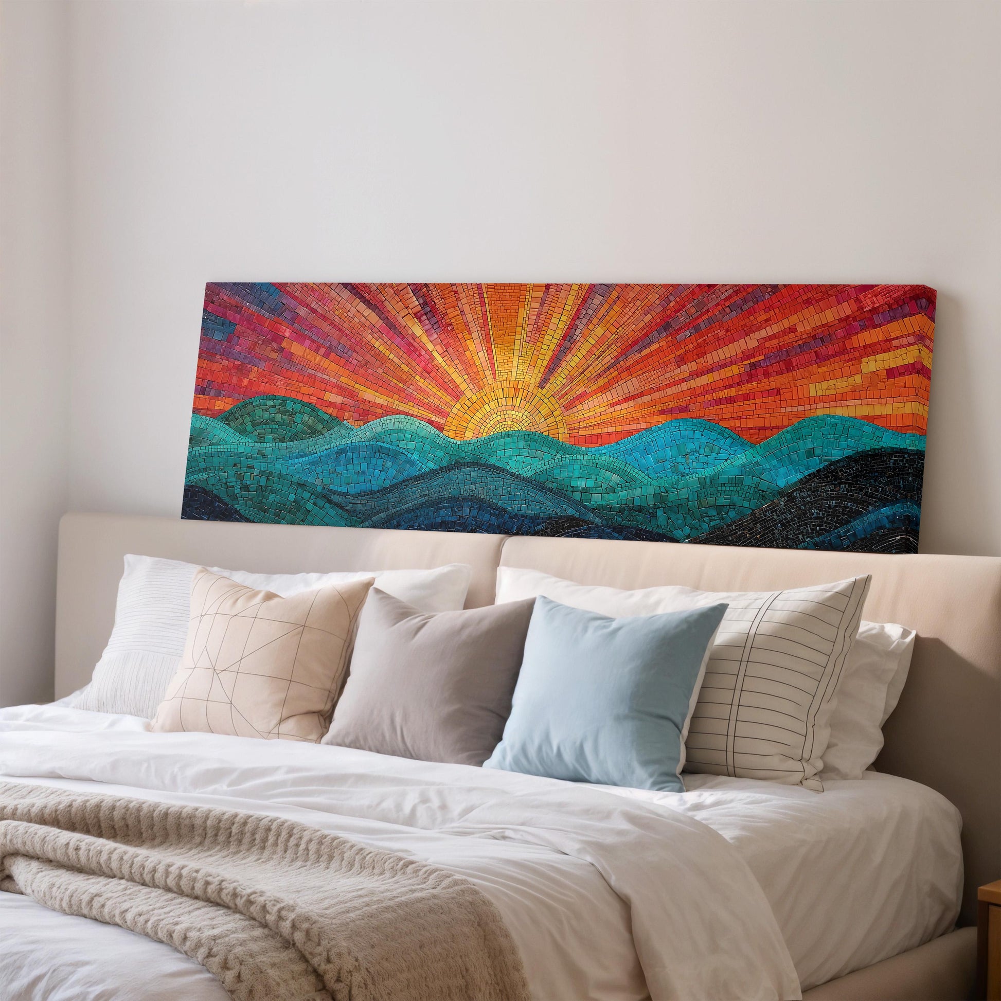 a large, colorful painting of a sunrise over a mountain landscape, hanging on the wall above a bed with white pillows and a gray blanket.