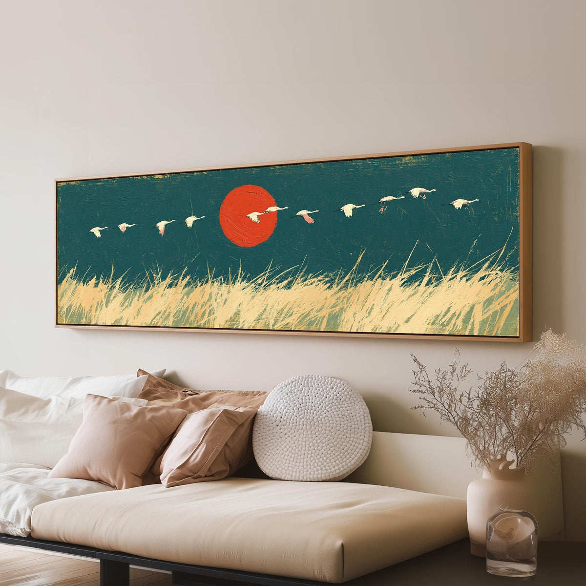 Bird flock over a prairie under a red sun panoramic canvas print above a sofa in a living room