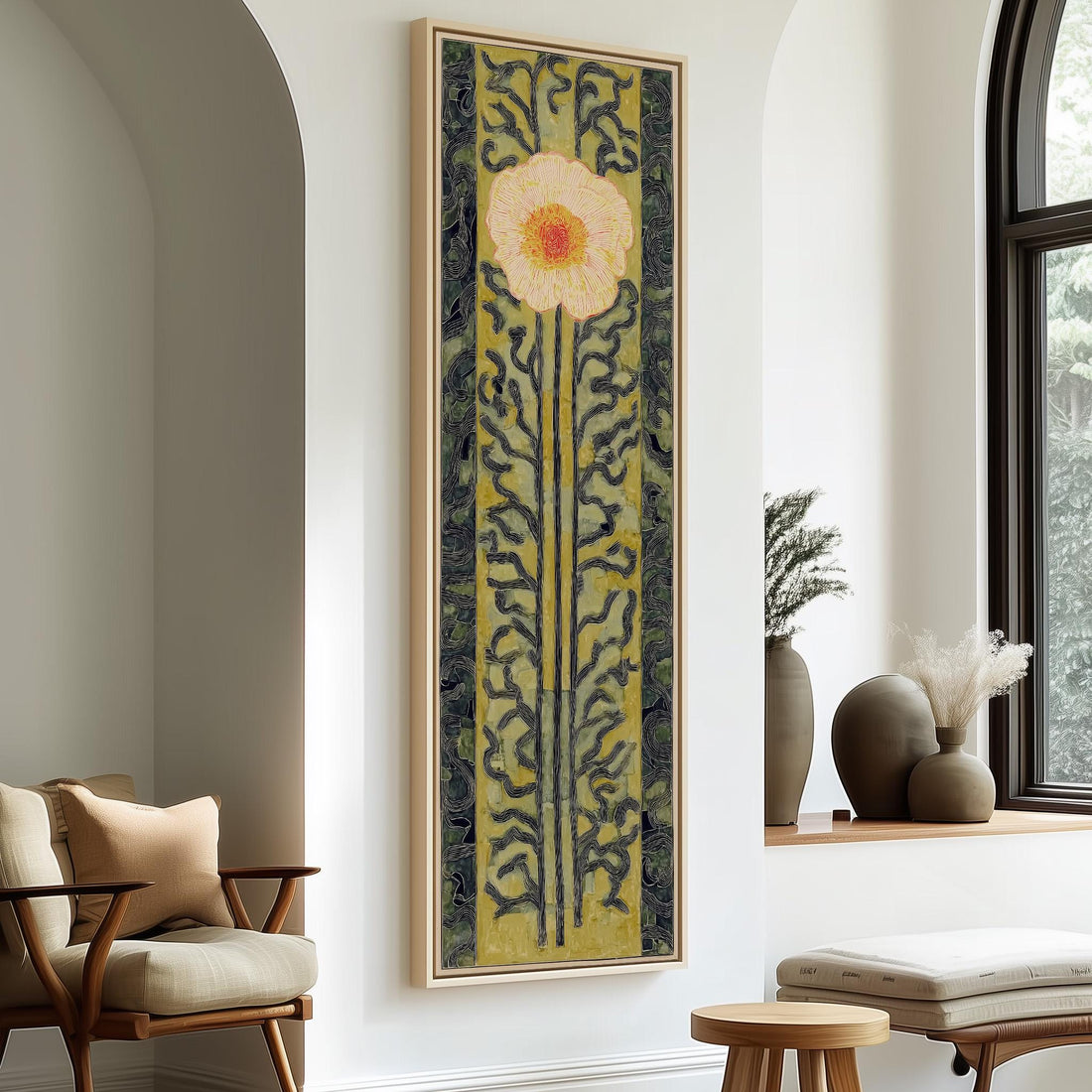 a large, colorful painting of a flower hanging on a wall, with a wooden chair and a small table in the foreground.