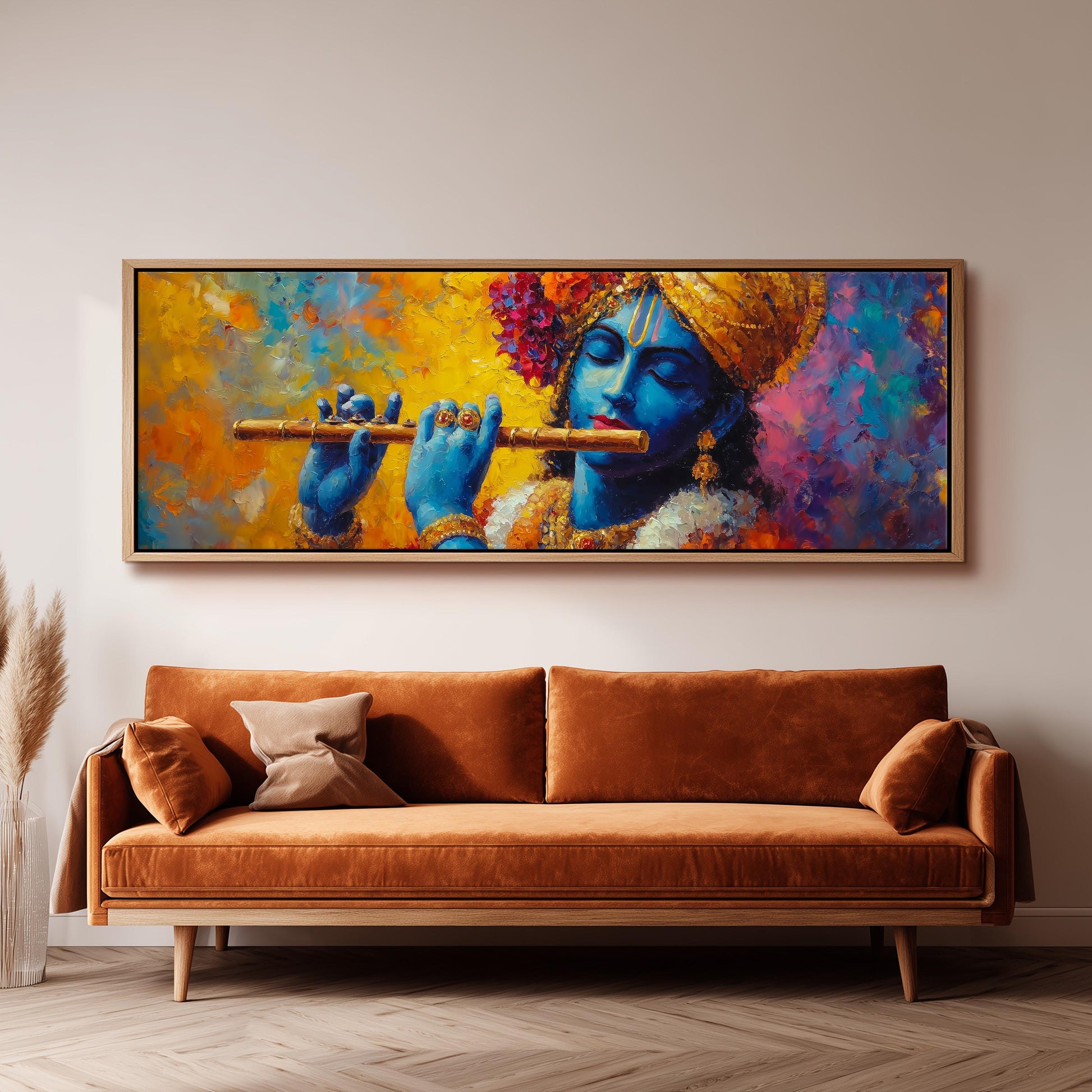a large painting of a blue-skinned man playing a flute, hanging on a wall above a brown sofa.