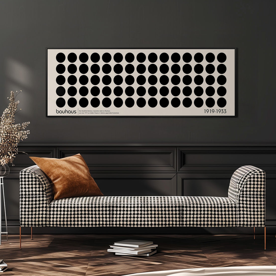 a modern living room with a black and white checkered sofa, a stack of books, and a large abstract art piece on the wall.