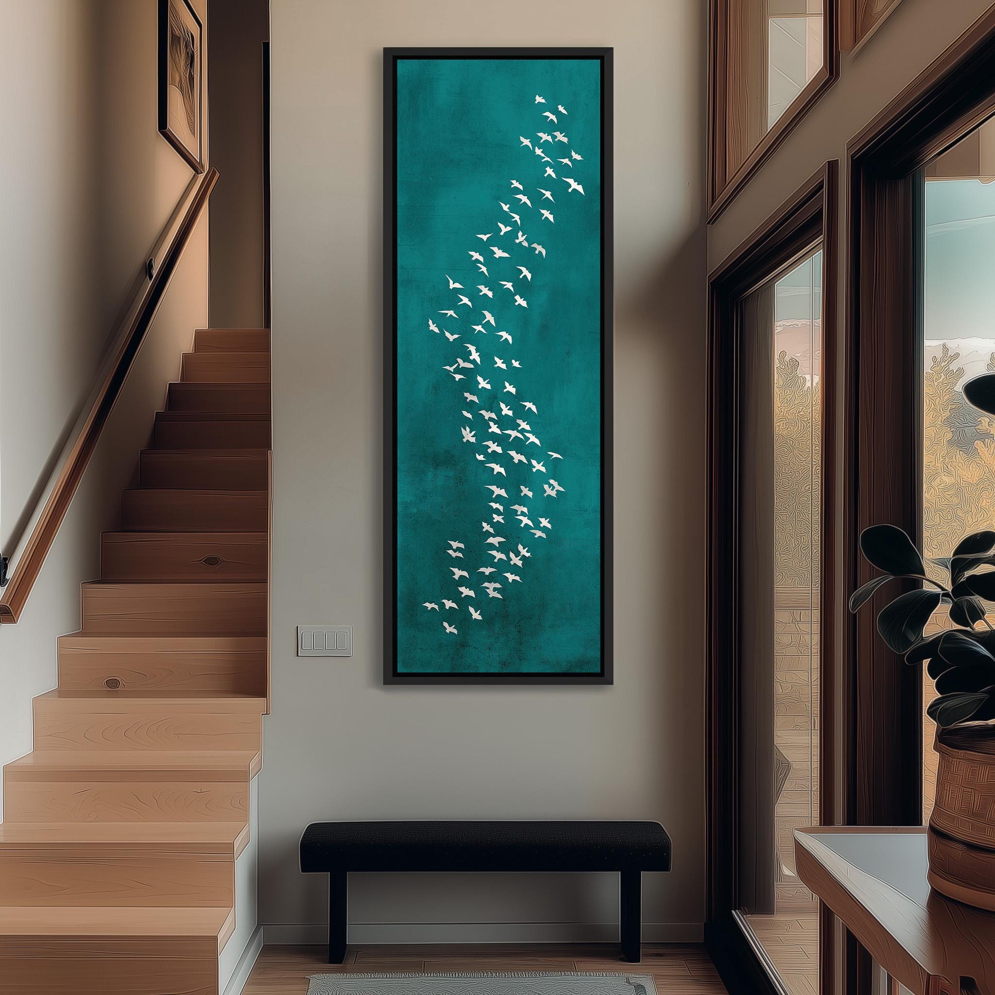 a hallway with a large painting of white birds on a teal background hanging on the wall. The hallway has wooden stairs leading up to a door, and there is a bench in the foreground.