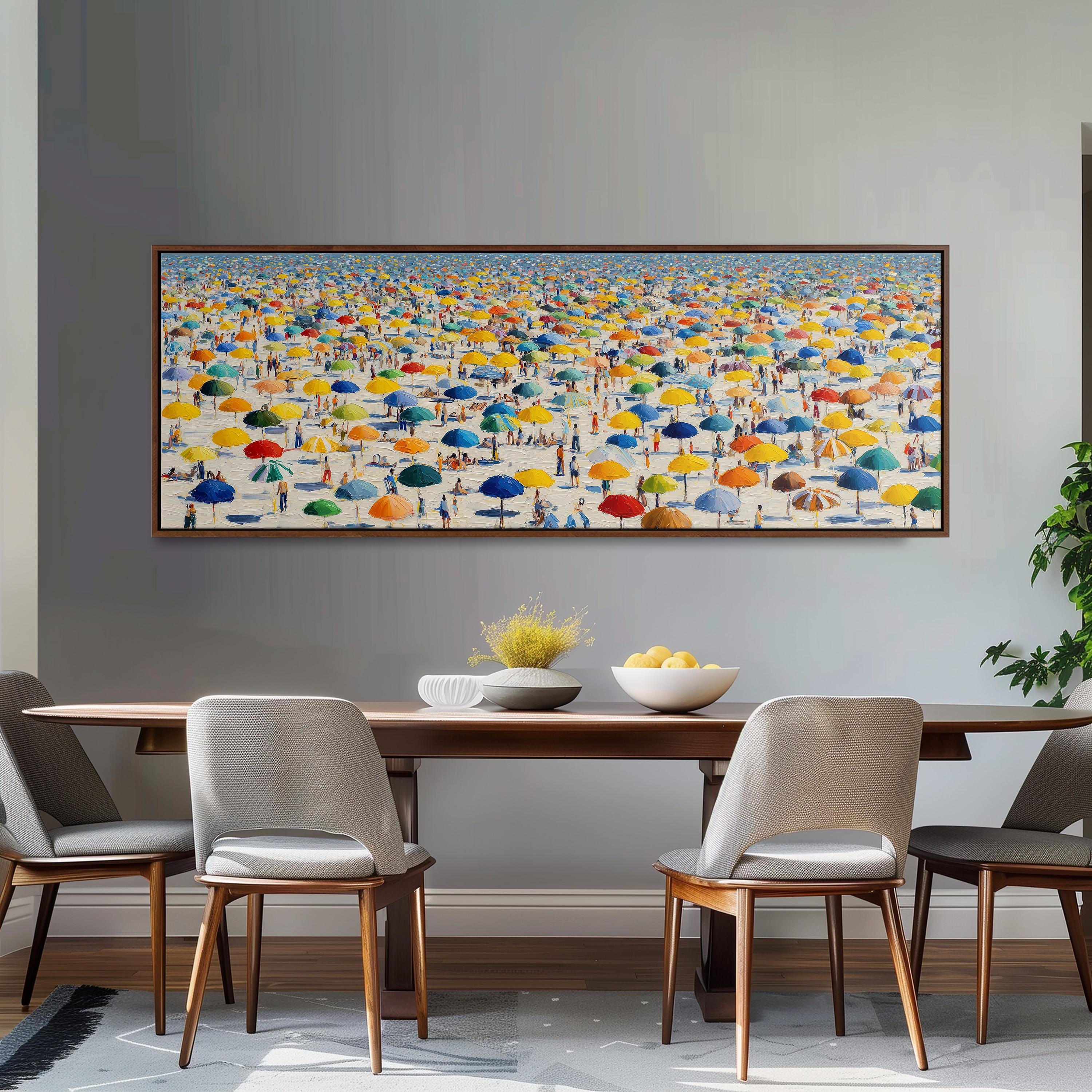 a large, colorful painting of a beach scene with numerous umbrellas and people enjoying the day. The painting is displayed on a wall above a wooden dining table with four chairs.