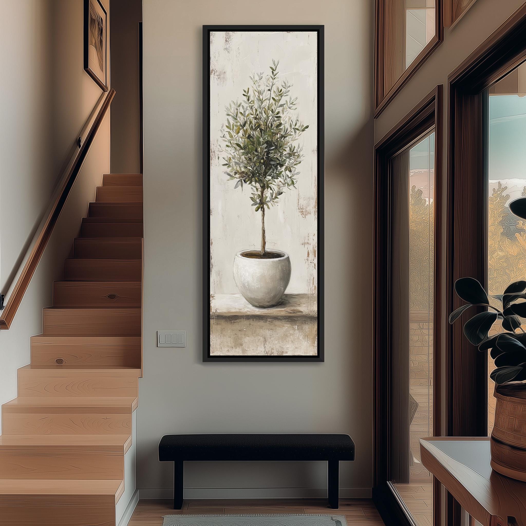a large painting of a tree in a white pot hanging on a wall, with a wooden staircase and a bench in the foreground.