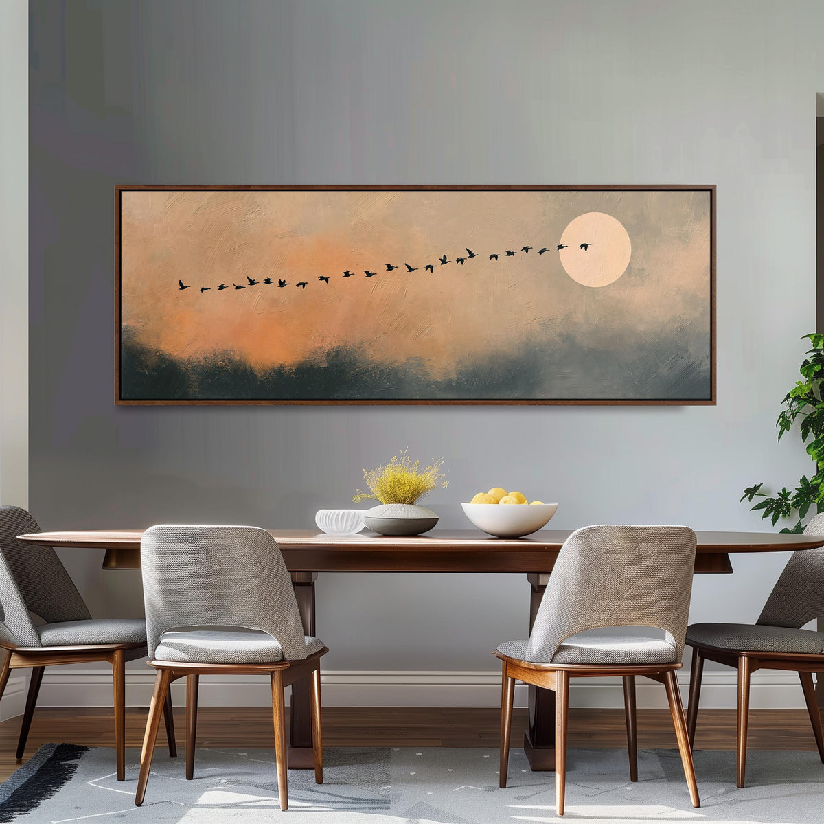 Migrating birds passing a moon at peach dusk long horizontal canvas print above a dining table