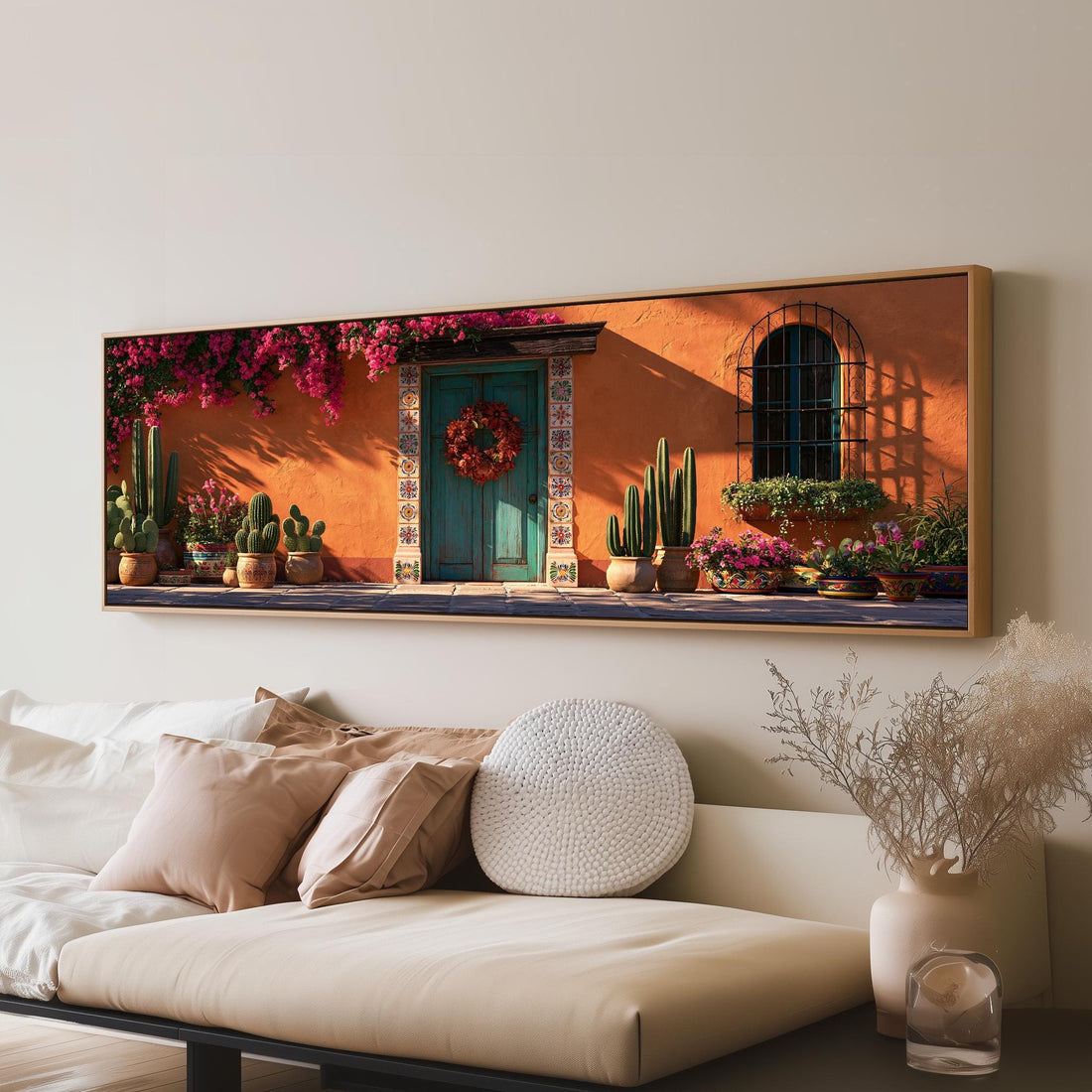 Mexican courtyard doorway with bougainvillea long horizontal canvas print above a sofa in a living room