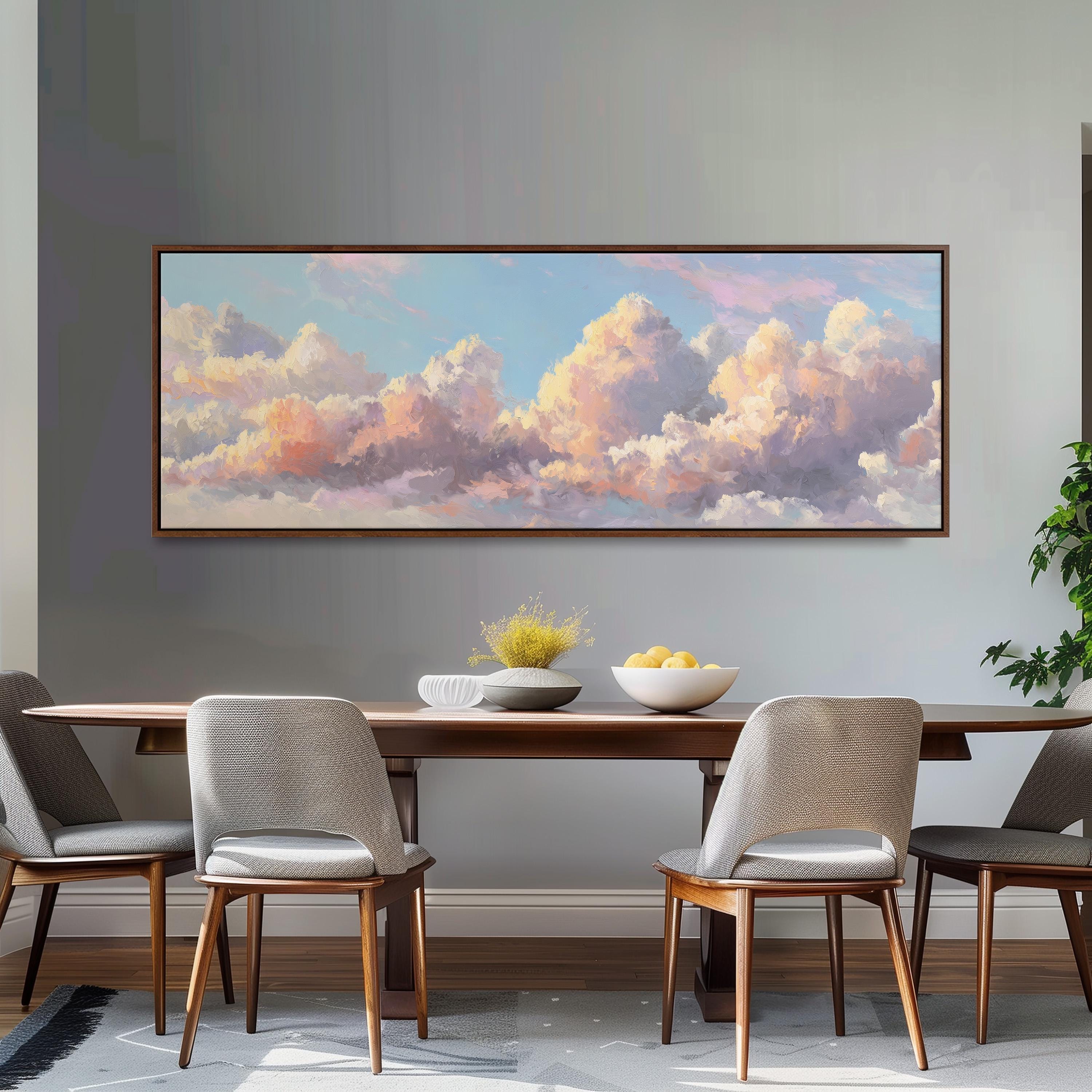 a dining room with a large painting of a cloudy sky hanging on the wall above a wooden dining table with four chairs. The table is set with a bowl of fruit and a vase of flowers, creating a cozy and inviting atmosphere.