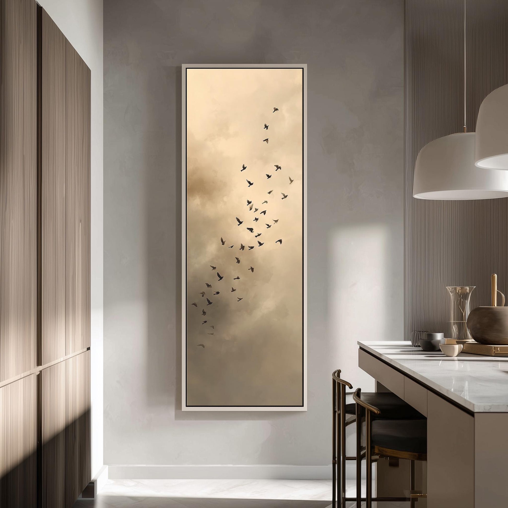a large framed picture of a flock of birds flying against a cloudy sky, hanging on a wall in a modern kitchen.