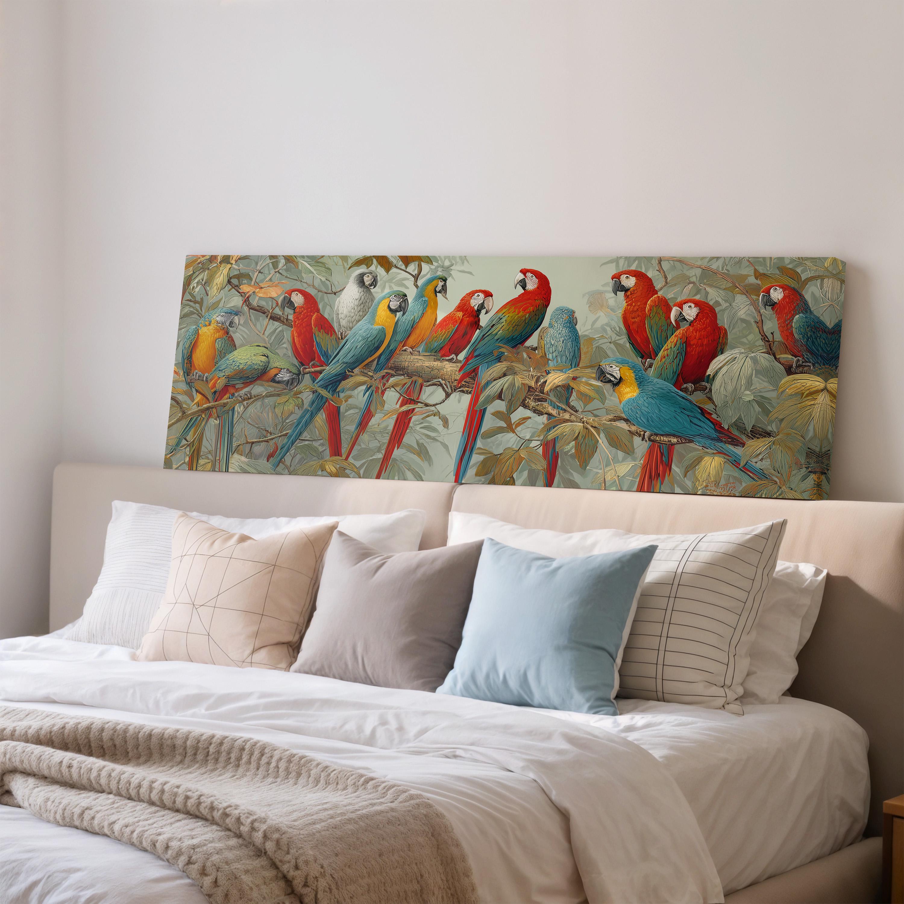 a large, colorful painting of parrots perched on branches, displayed on a wall above a bed with white bedding and pillows.