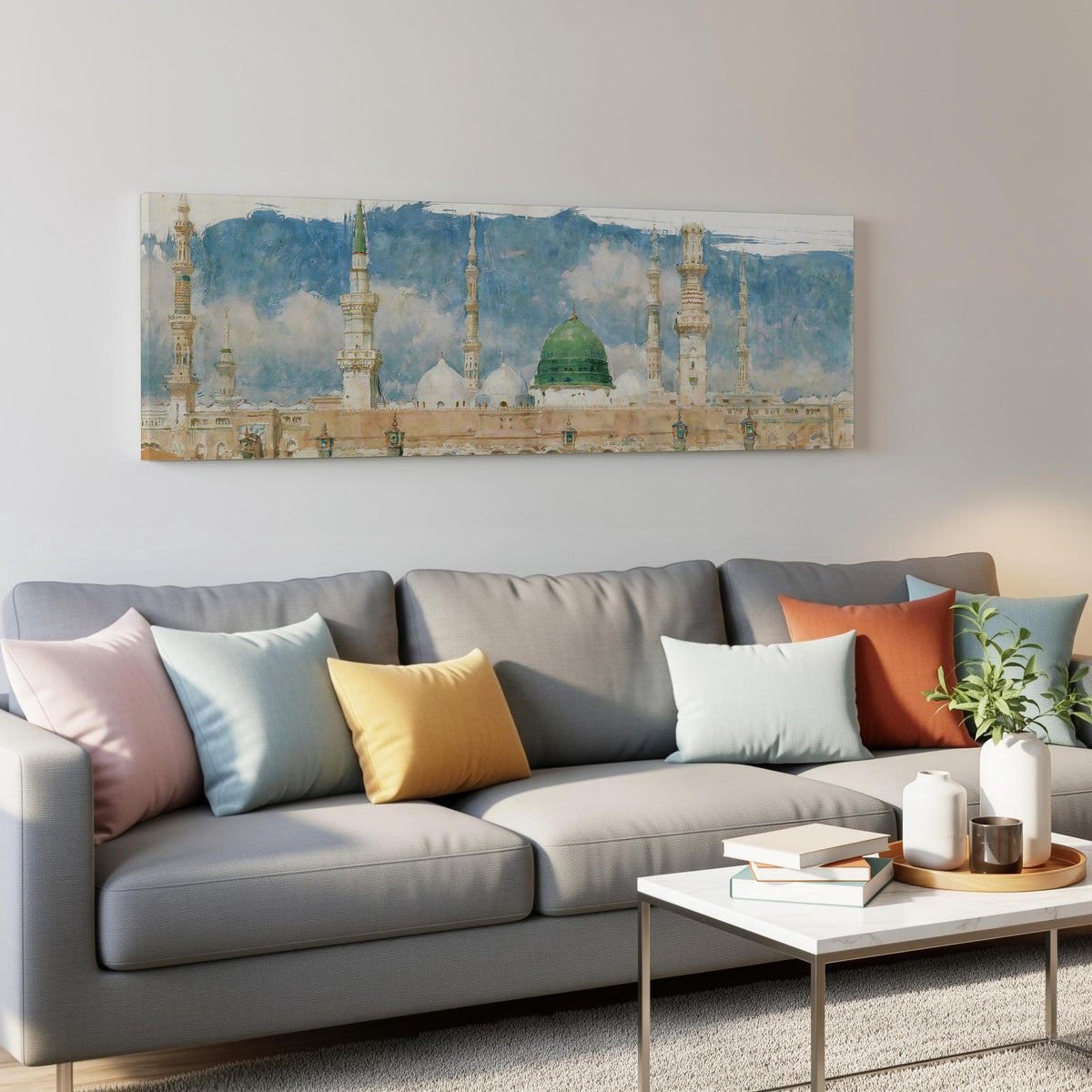 The green dome of the Prophet's Mosque in Medina panoramic canvas print above a grey sofa in a living room
