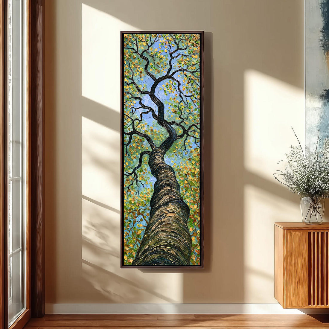 Twisting tree rising into a gold and green canopy long vertical canvas print in a sunlit living space