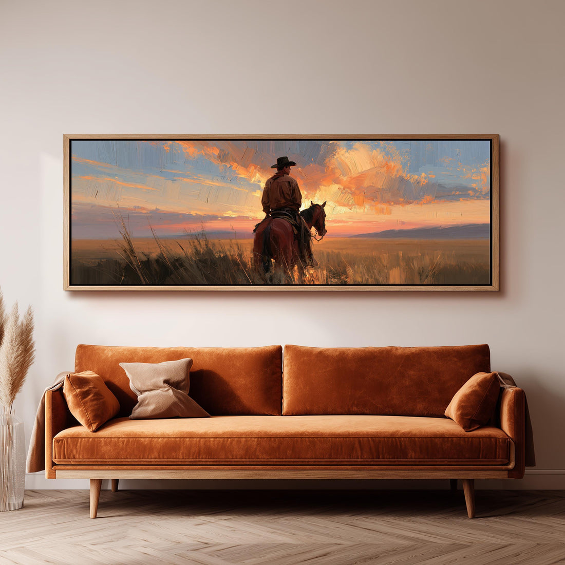 Cowboy on horseback at a golden sunset long horizontal canvas print above a sofa in a living room