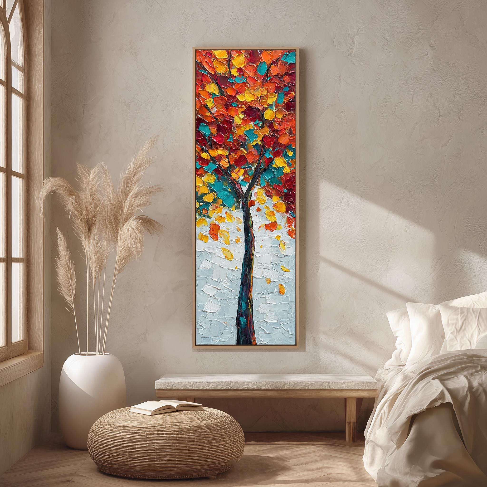 a large, colorful painting of a tree hanging on a wall in a room with a wooden floor and a white bed.