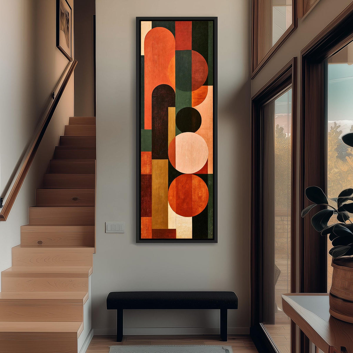 Terracotta, navy and blush arch and circle totem tall narrow canvas print beside a staircase in an entryway