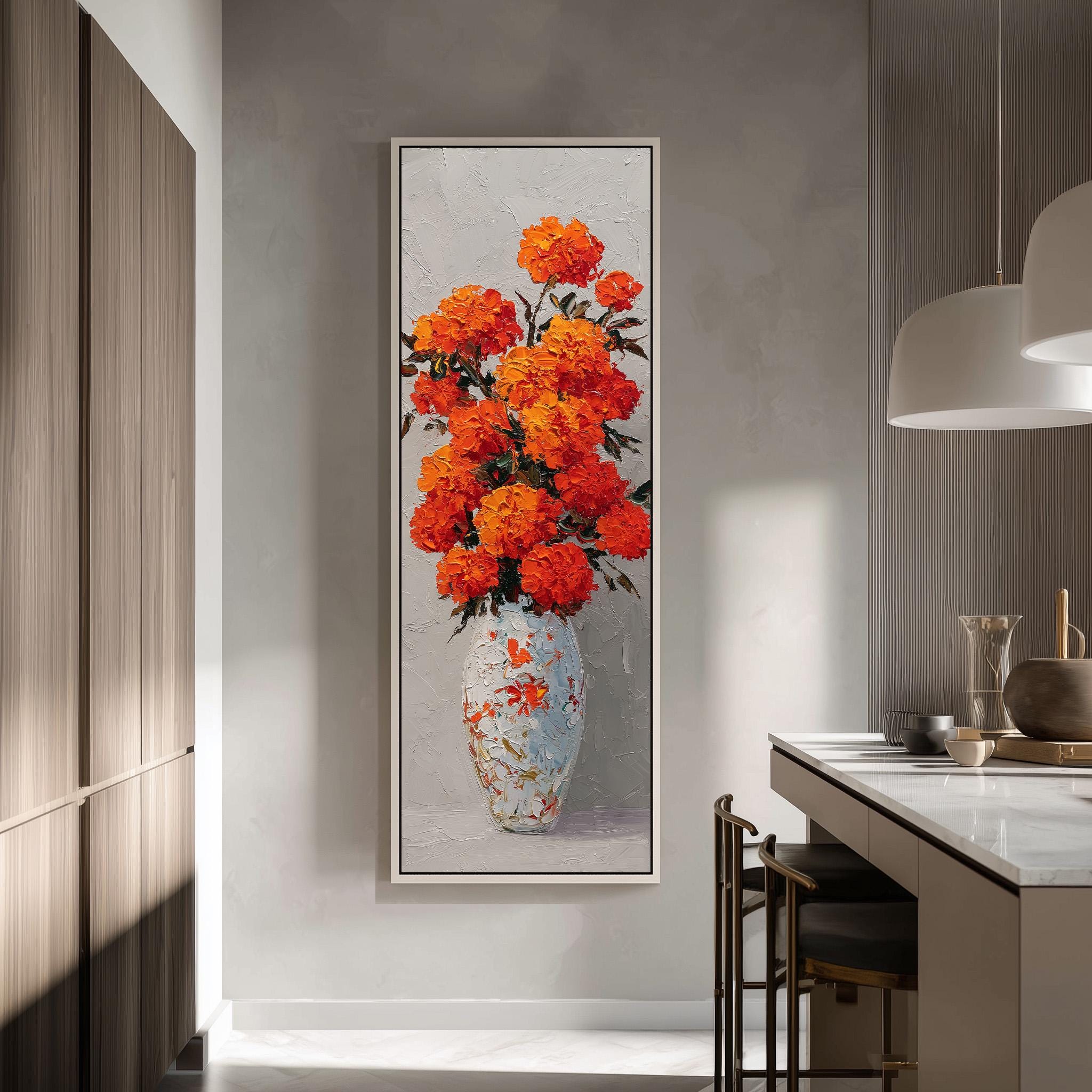 a large, framed painting of a vase filled with vibrant orange flowers, hanging on a wall in a modern kitchen.
