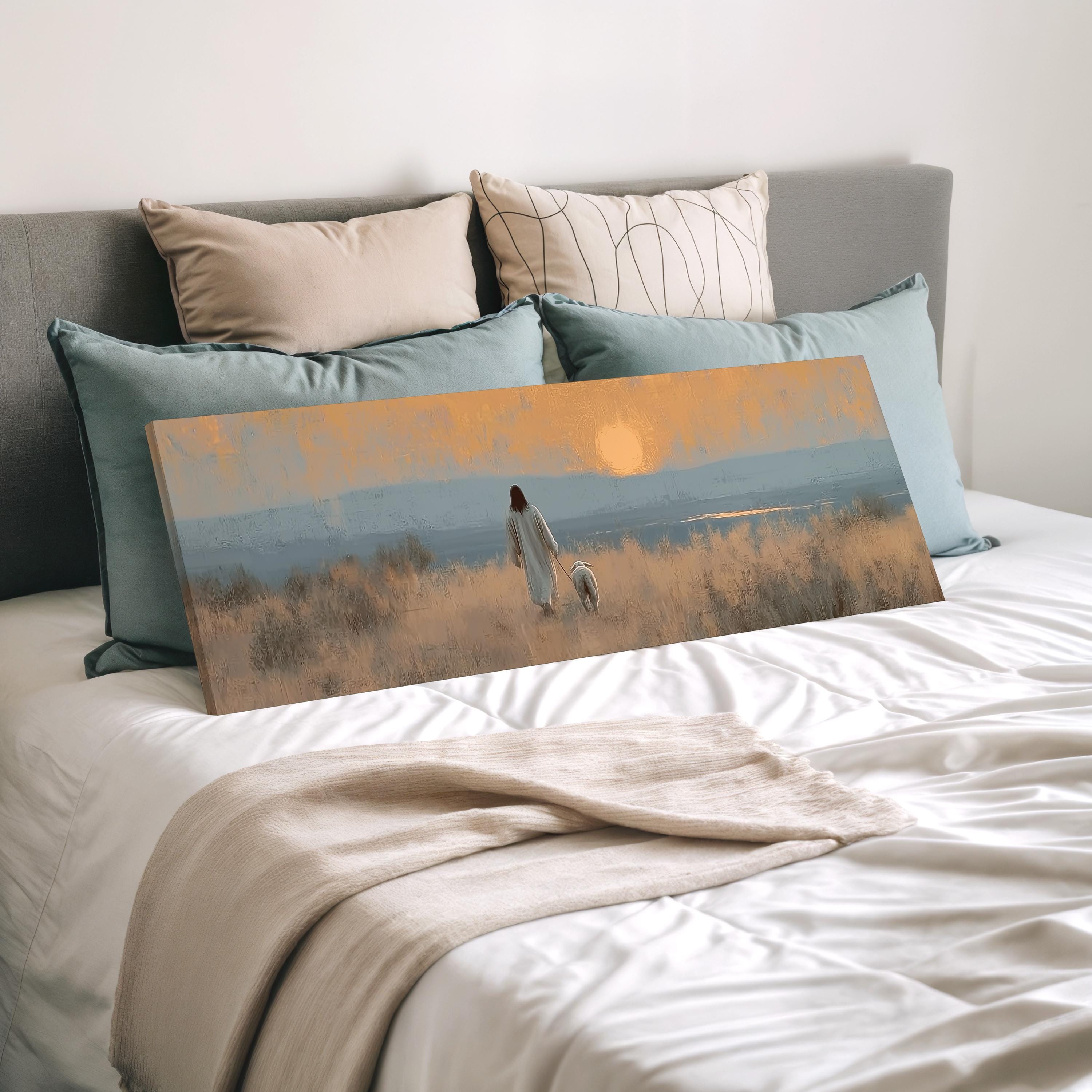 a bedroom with a bed and a large canvas print depicting a person walking in a field with a dog.